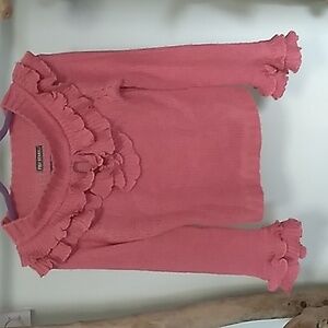 Fili Stars knit light sweater. ruffle cuffs, wide neckline with keyhole opening